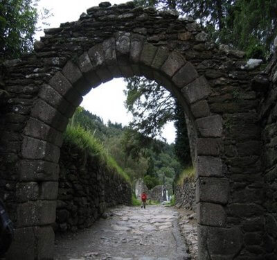 Glendalough's 6th century monastic settlement's stone archway and path