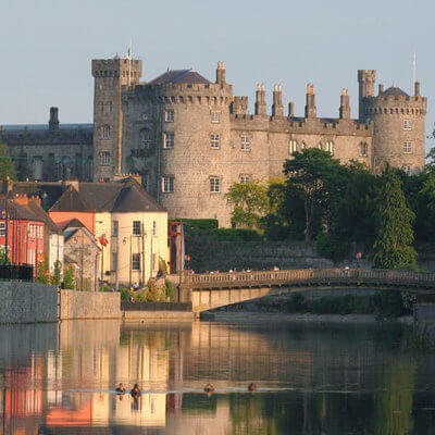 Kilkenny castle sitting prominently on the River Nore overlooking the city